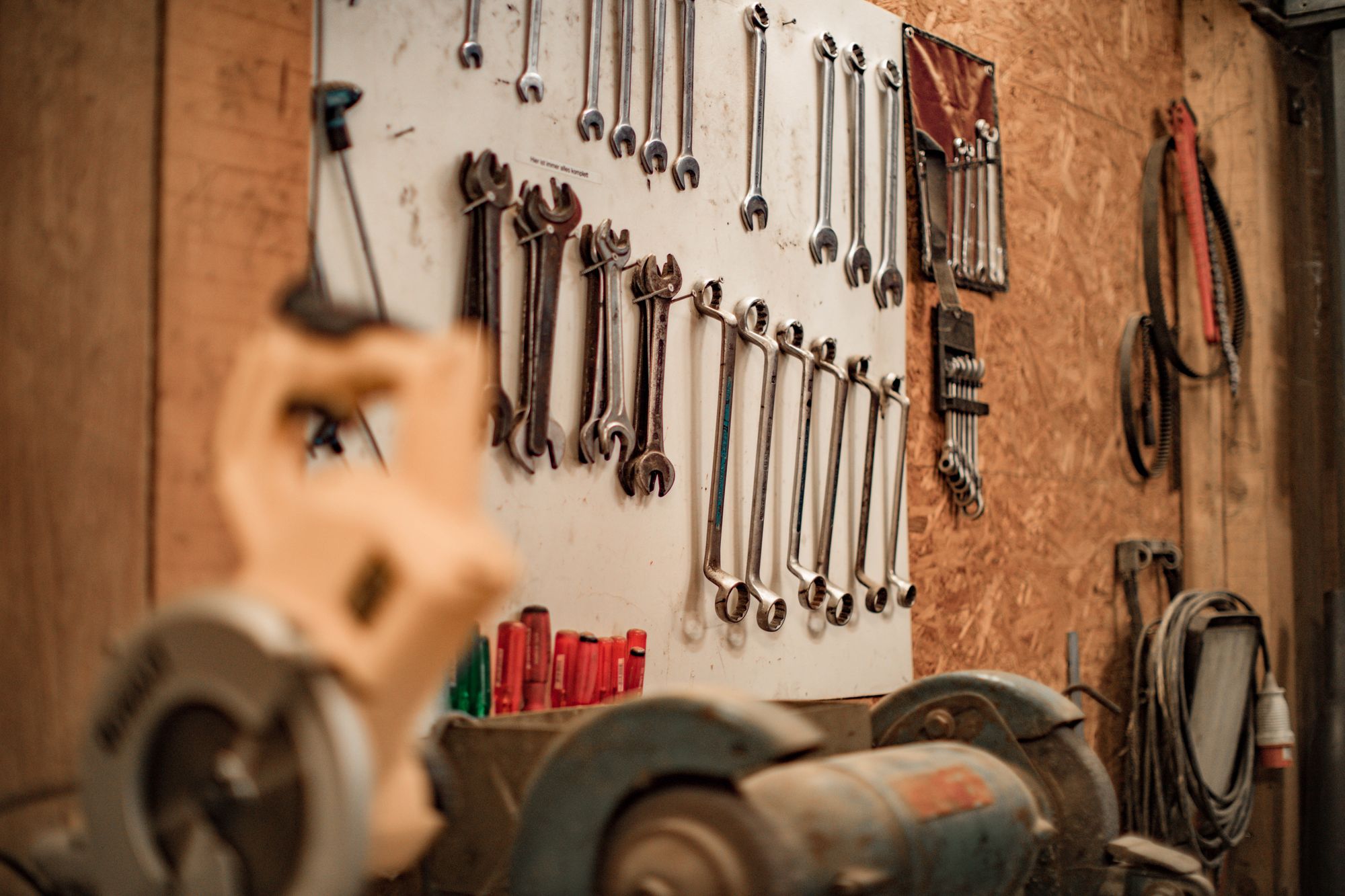 Wrenches and tools hanging on the wall.