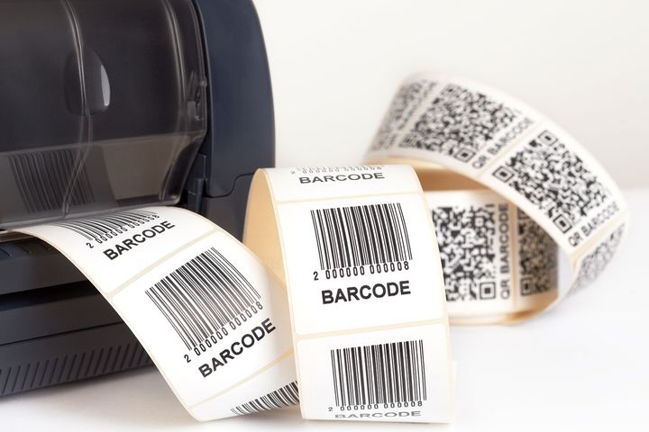 Barcode printer printing barcodes and QR codes.