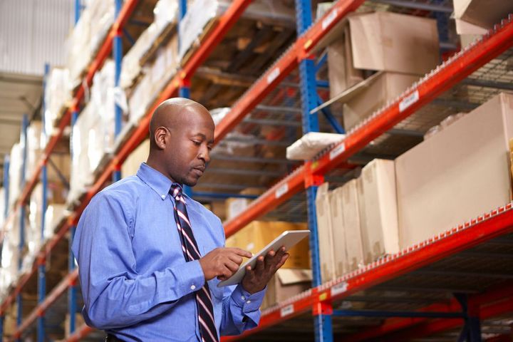 Accountant conducting inventory audit in the warehouse